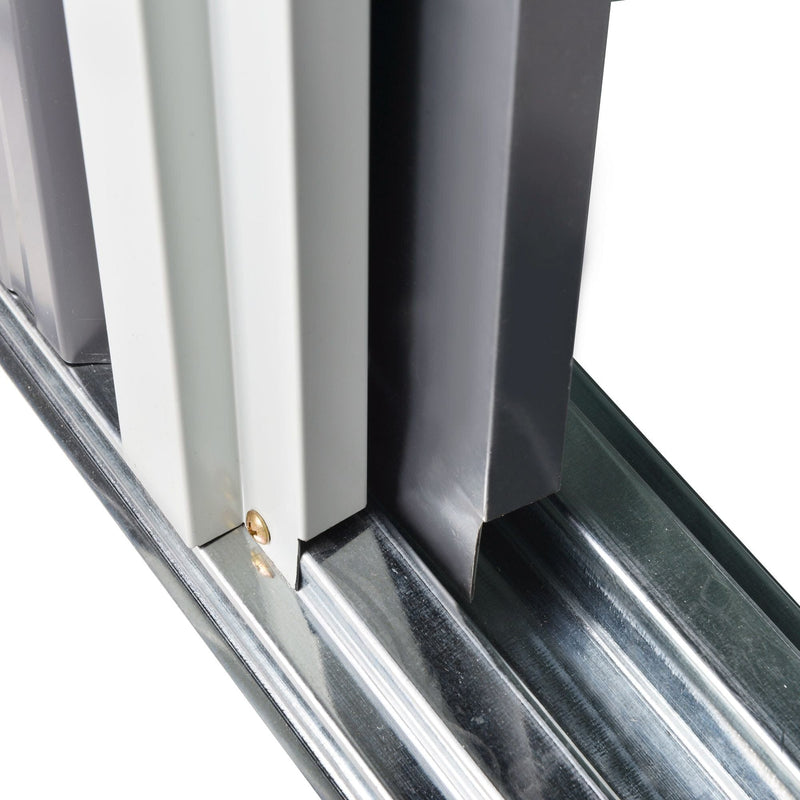 Close-up of the sliding door running in its galvanised steel bottom track