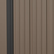 Close-up of the ribbed brown steel wall panels and dark grey corner post of the shed