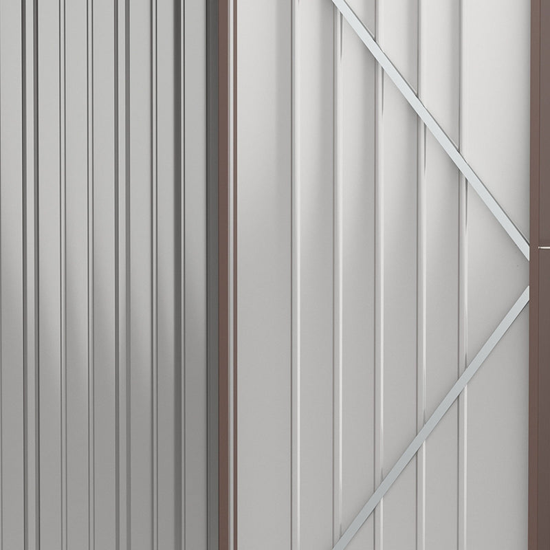 Close-up inside the shed door showing the pale interior lining and diagonal reinforcing brace