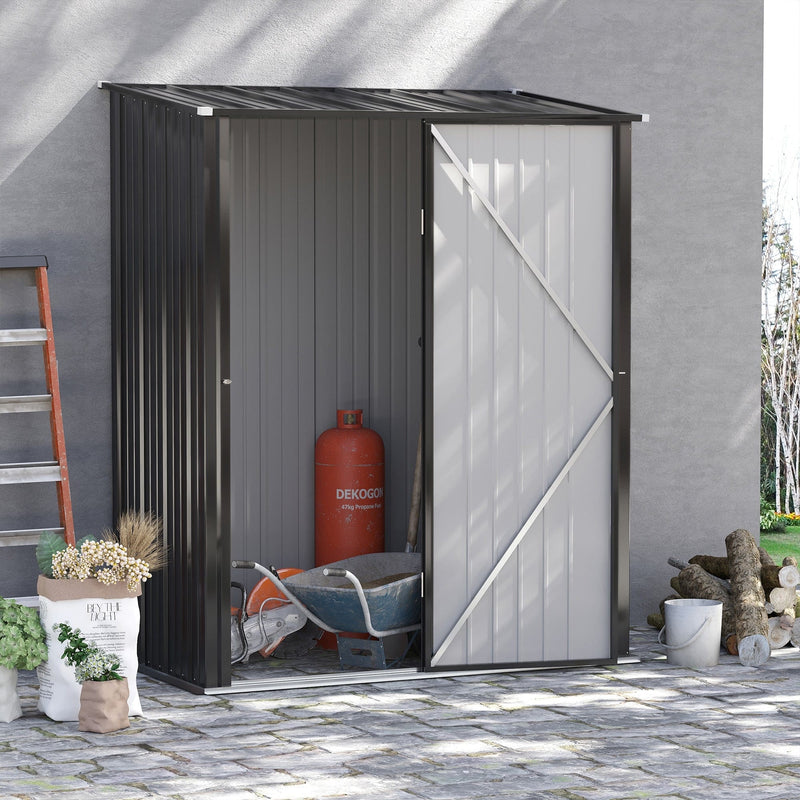 Grey metal shed on a paved patio with the door open, holding a gas bottle, hose reel and step ladder