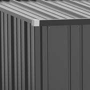 Close-up of the corrugated roof edge and corner cap above the grey steel side panel
