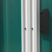 Close-up of the sliding door edge and the black door handle on the green steel end wall