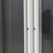 Close-up of the dark grey shed's sliding door edge, white frame trim and fixing screws