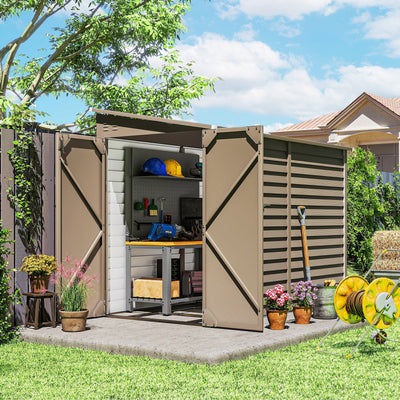 The brown lean-to shed in a garden with both doors open, showing a workbench and pegboard inside