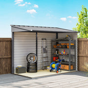 Cutaway view of the grey shed against a fence holding tyres, shelving, a hose reel and a step ladder
