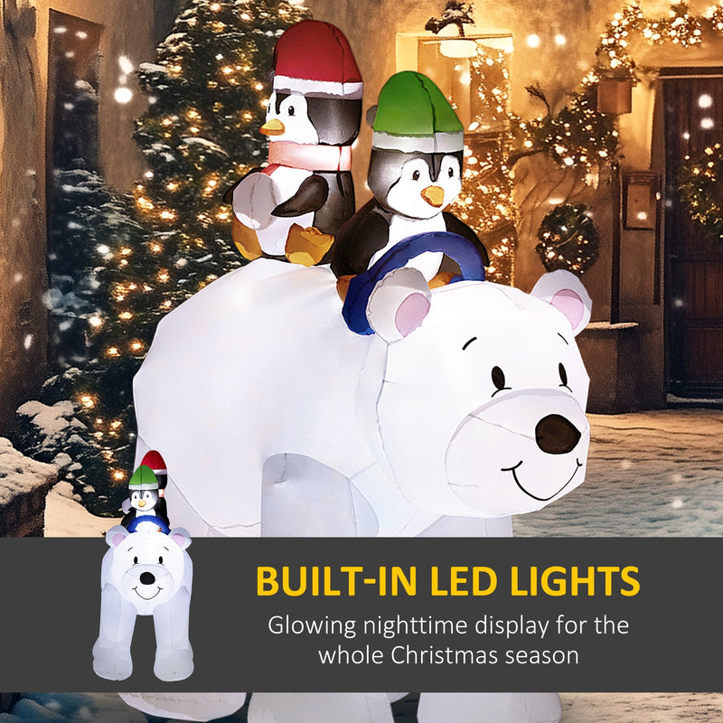Lit polar bear and penguins in a snowy street with a built-in LED lights caption