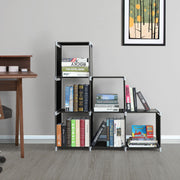 Storage shelf styled with books and boxes in each cube