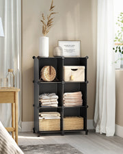 Black cube storage unit in a bedroom or living room setting