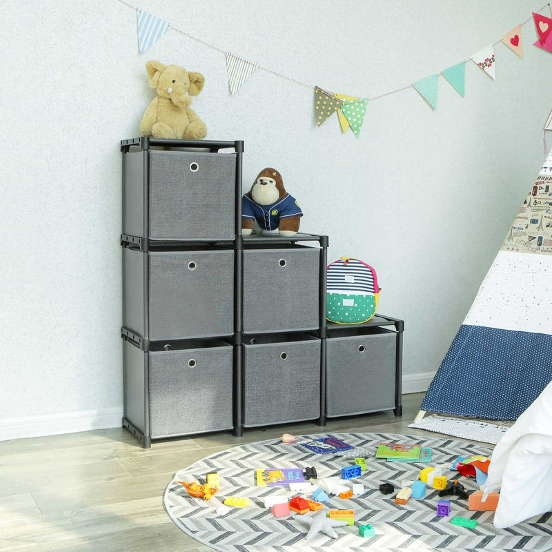 Step-shaped unit in a child's room with soft toys on the steps and toys on the rug below