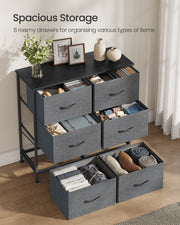All 6 fabric drawers pulled open and filled with folded clothes and accessories