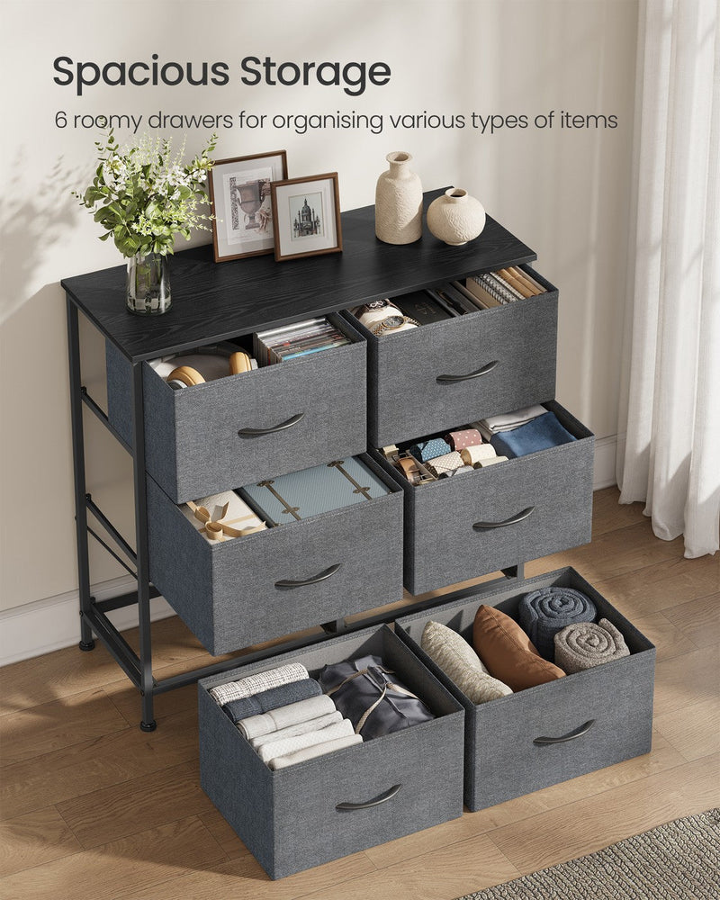 All 6 fabric drawers pulled open and filled with folded clothes and accessories