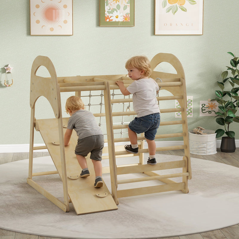 Two children climbing the wooden ladder and reversible slide on the Aiyaplay climbing frame in a playroom