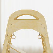 Close-up of the arched frame top with hanging gymnastics rings