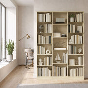 Oak open bookcase styled with books and decor in a home office