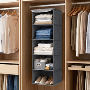 Grey hanging wardrobe organiser on a wardrobe rail holding folded clothes and shoes