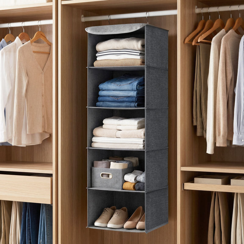Grey hanging wardrobe organiser on a wardrobe rail holding folded clothes and shoes