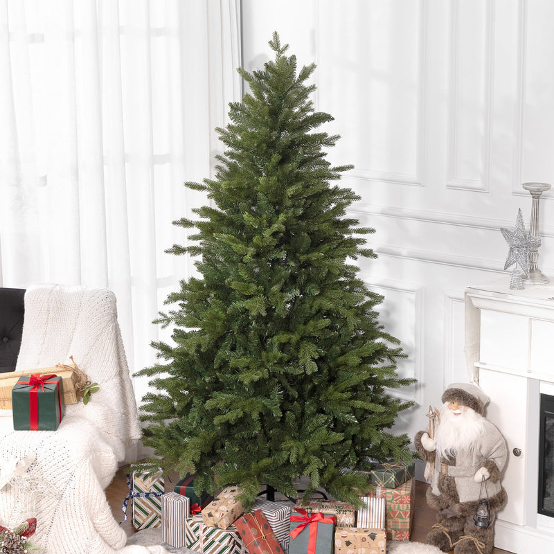 Wide green Christmas tree in a bright room beside an armchair and a fireplace