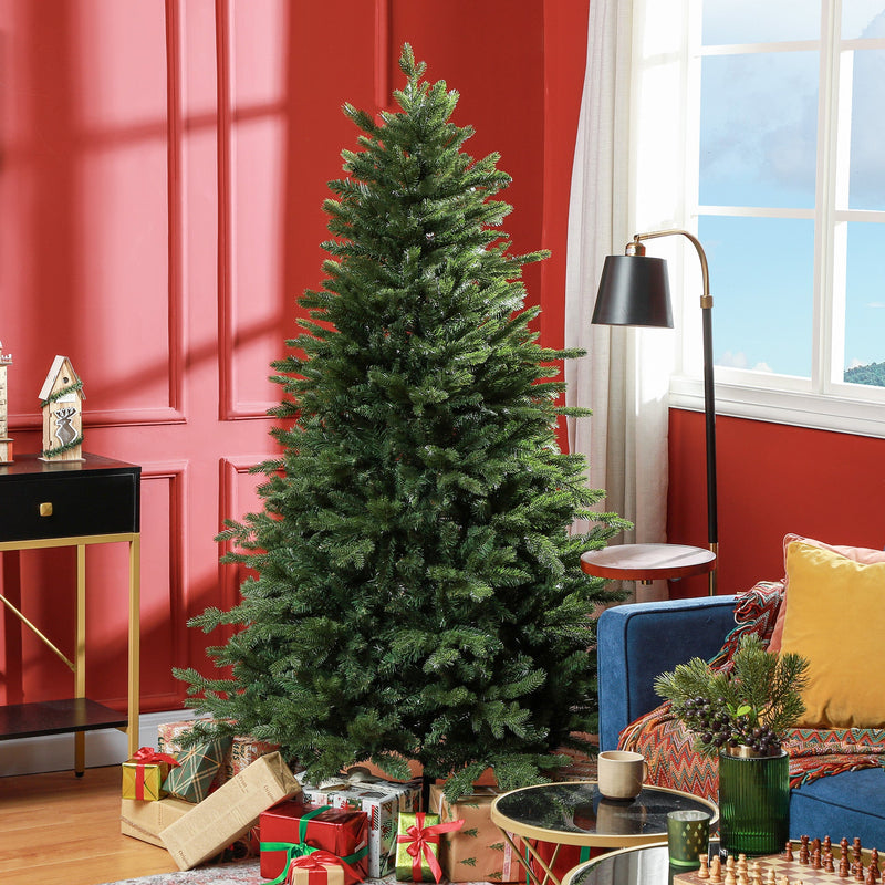 Full green Christmas tree in a red living room with a blue sofa, gifts and a side table