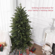 Green Christmas tree by a white fireplace with a striking centrepiece caption