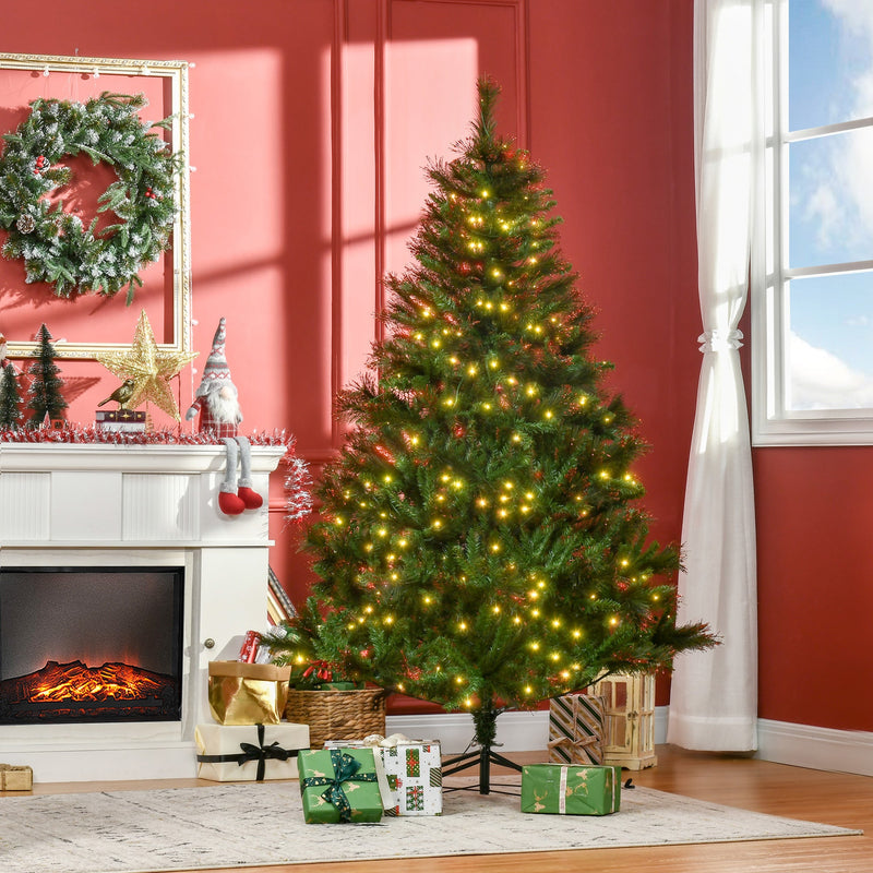 Lit Christmas tree in a red-walled living room with a wreath above the fireplace and wrapped gifts