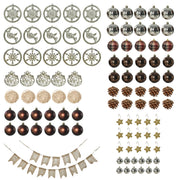 Flat lay of the decorations: snowflake and reindeer ornaments, baubles, pine cones, stars and a banner