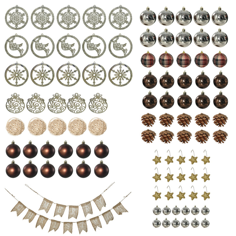 Flat lay of the decorations: snowflake and reindeer ornaments, baubles, pine cones, stars and a banner