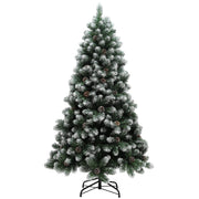 Studio shot of a 6ft snow-dipped pine Christmas tree on a black metal stand