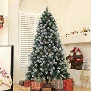 Tree beside wrapped gifts in an arched alcove