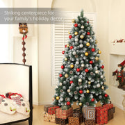 Tree decorated with red and gold baubles in a lounge with presents