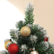 Close-up of the tree top with gold, red and silver baubles