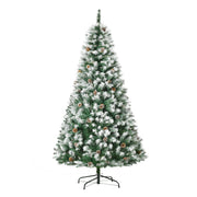 Snow flocked Christmas tree on its stand on a white background