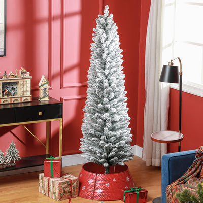 Snow-flocked 6ft pencil Christmas tree in a red living room with a red tree skirt and gifts