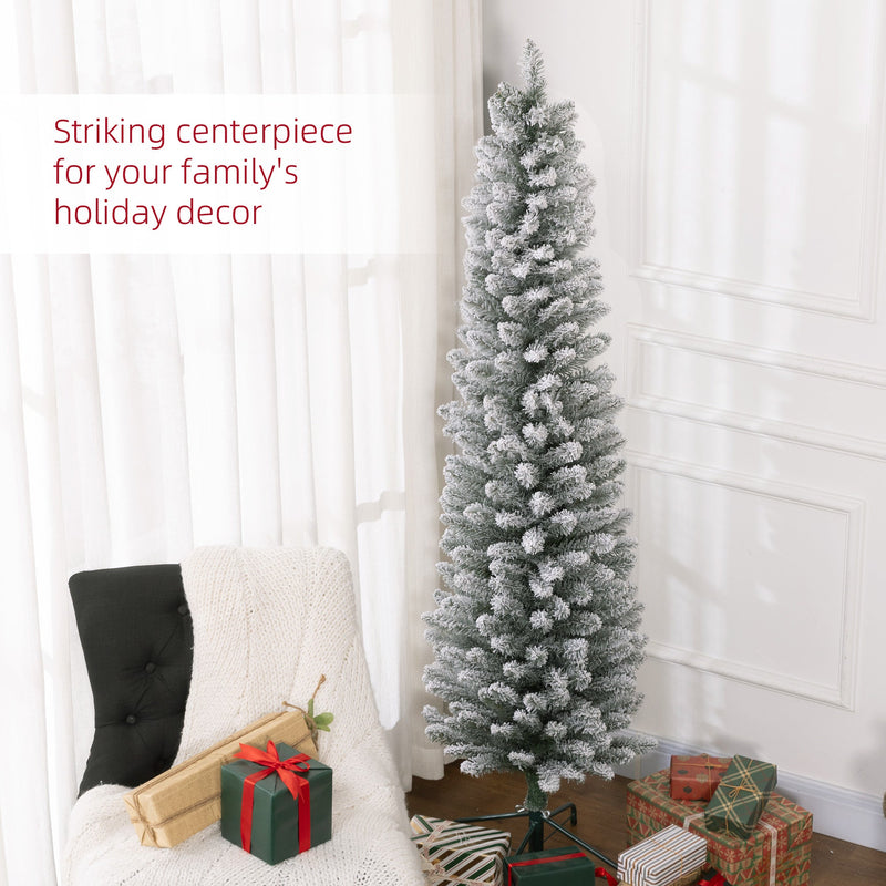 Snowy pencil Christmas tree beside a white armchair and gifts with a striking centrepiece caption