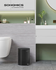 Close-up of the soft-close lid on the ink black bathroom bin