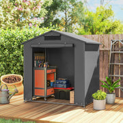 Small dark grey shed on decking with a tool trolley and tools inside