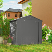 Back of the dark grey shed in a garden beside a house