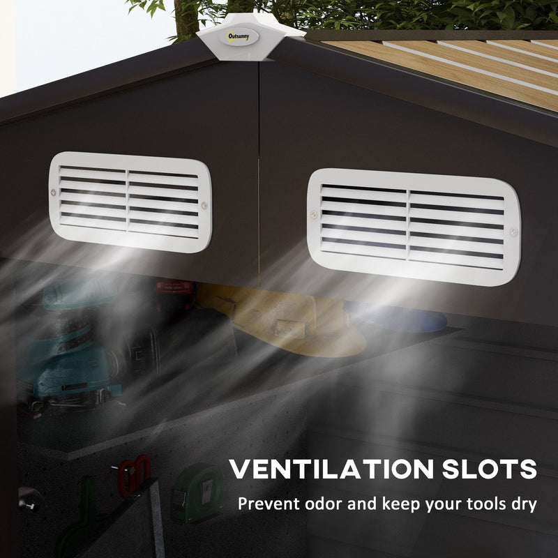 Two white ventilation slots set into the dark grey gable below the apex roof ridge