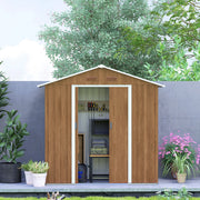 The shed set against a garden wall with both doors open, showing the apex roof and gable end