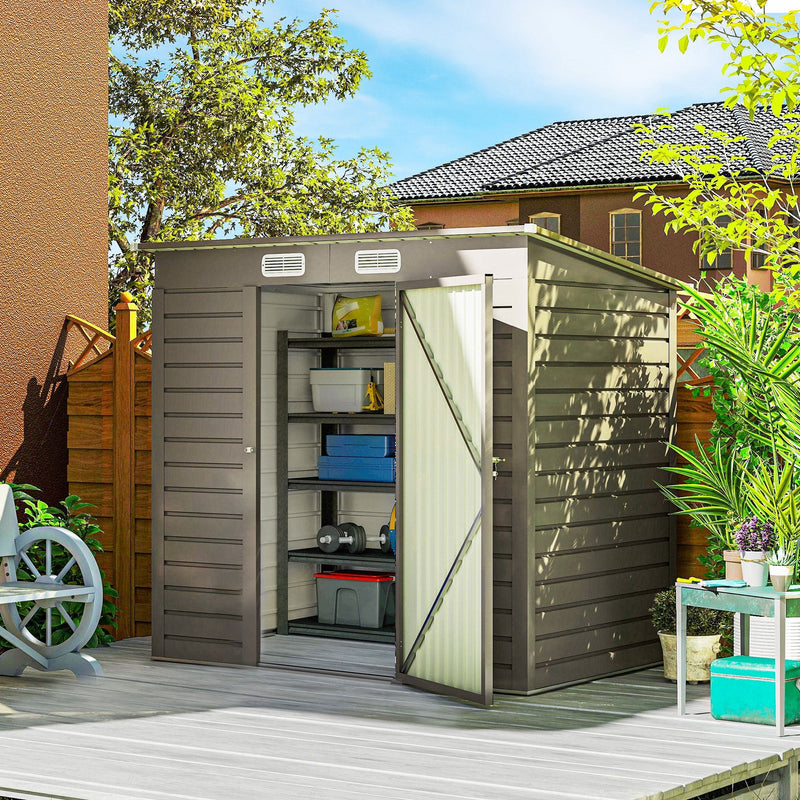6x4ft metal garden shed on a decked patio with its single door open showing loaded shelving inside