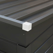 Close-up of the shed roof edge, white corner cap and ribbed roof panels