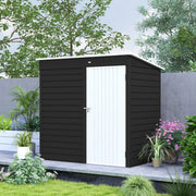 Dark grey metal shed with the white door closed, standing beside garden planting
