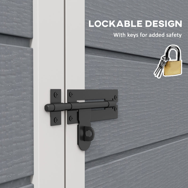 Close-up of the black latch across the double doors with the padlock and keys