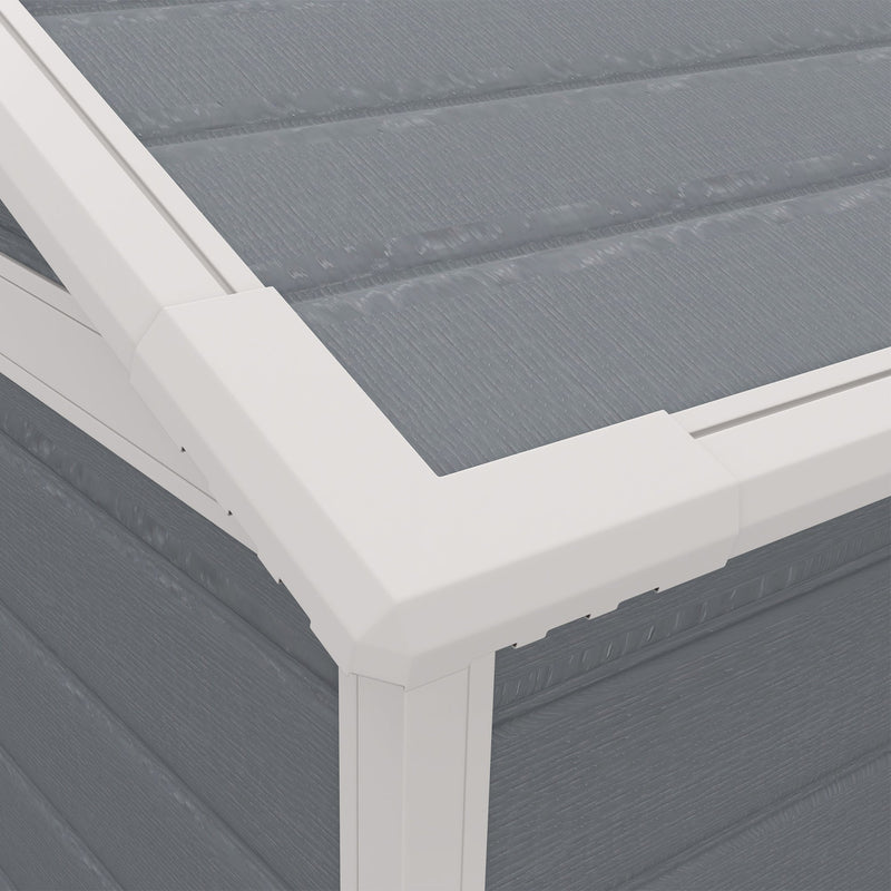 Close-up of the white roof trim and grey plastic roof panels at the shed corner