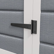 Close-up of a black T hinge fixed to the white door frame of the shed