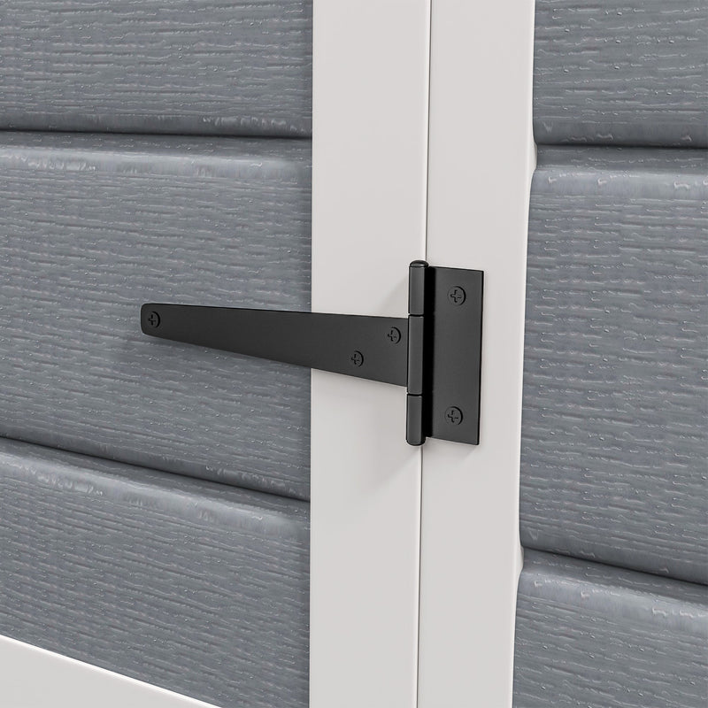 Close-up of a black T hinge fixed to the white door frame of the shed