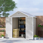 Plastic garden shed on a patio with both doors open showing shelving and boxes inside
