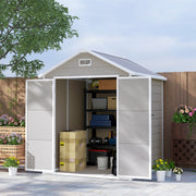 Dark grey 6x5ft shed in a garden with doors open showing shelving, boxes and weights