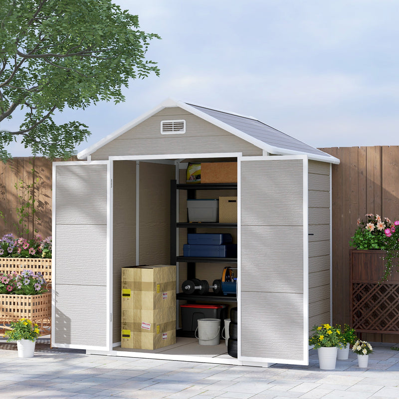 Dark grey 6x5ft shed in a garden with doors open showing shelving, boxes and weights