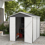 White 6x9ft metal garden shed in a garden with the door open showing stored tools