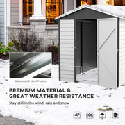 White metal garden shed standing in snow with a galvanised steel frame close-up